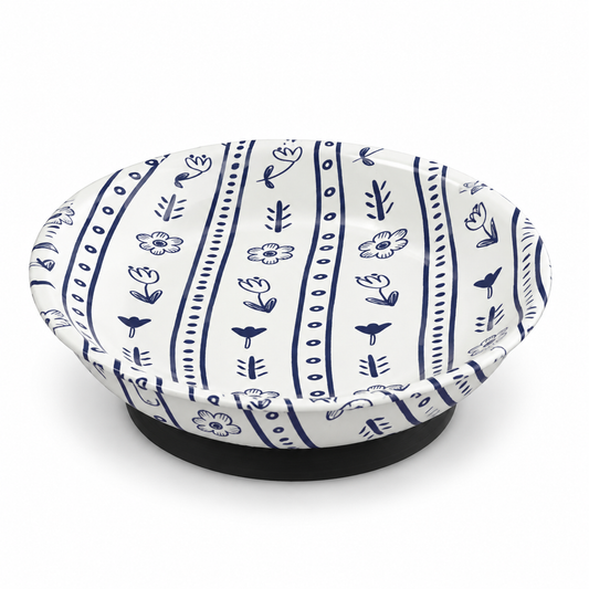 Blue-and-white floral magnetic ORT bowl and needle minder with a shallow round dish and black base